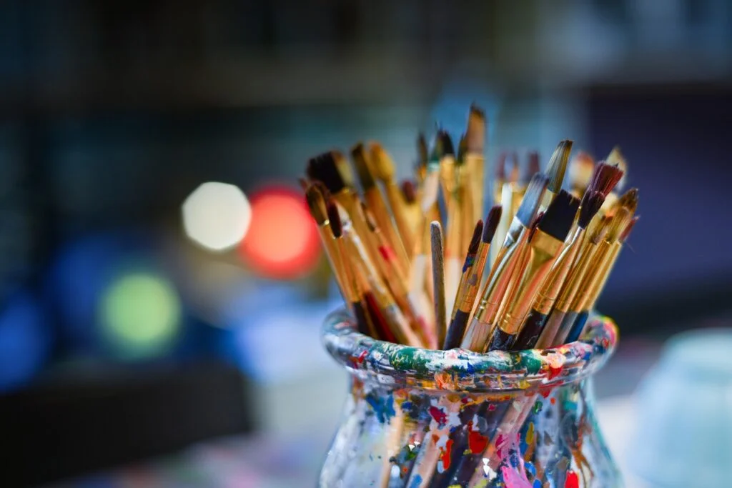 Paintbrushes in a pot. Self-care for depression.