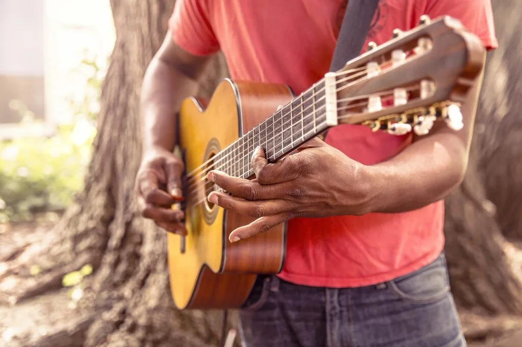 A man playing the guitar.