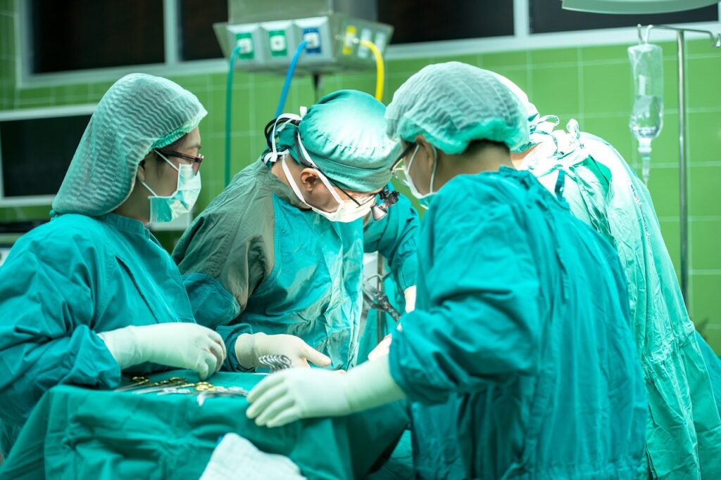 Surgeons working on an operation, possibly an emergency.